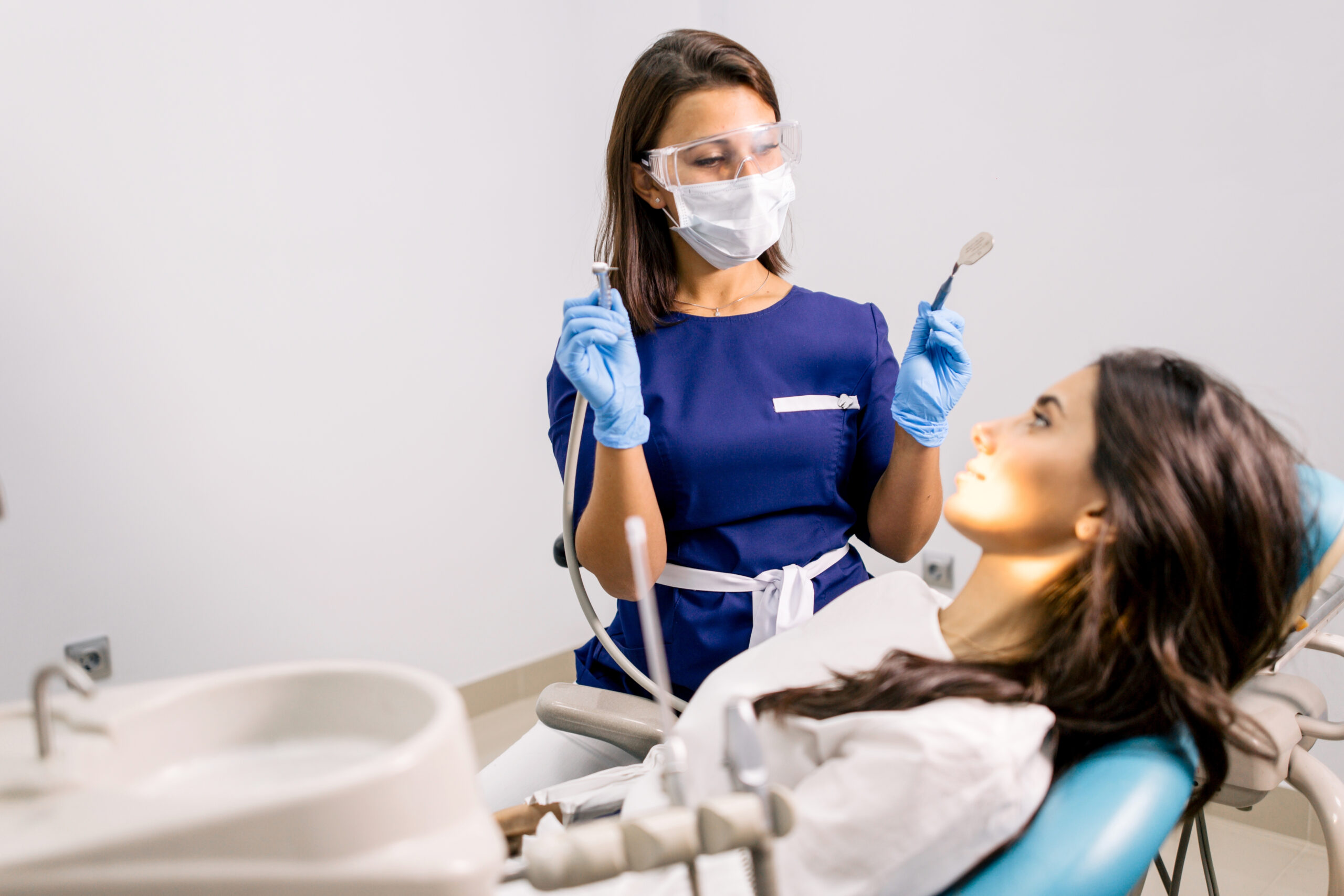 OMNI family health - girl dentist blue uniform getting ready