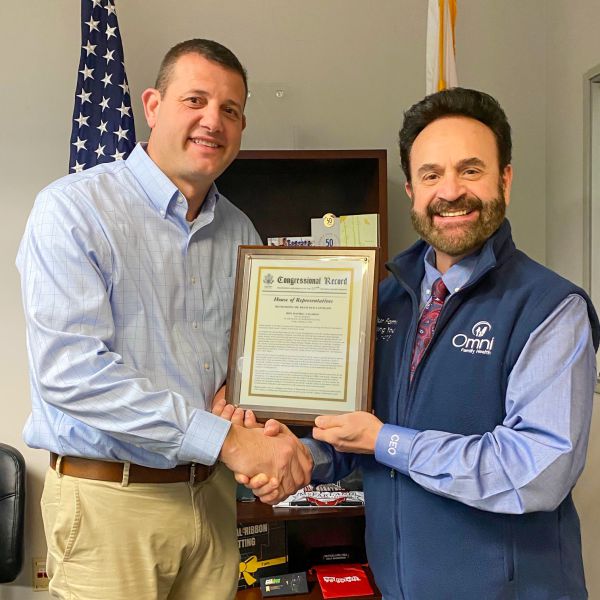 Omni Family Health Chief Executive Officer Francisco L. Castillon, MPA, receives a Congressional Record from Congressman David G. Valadao.