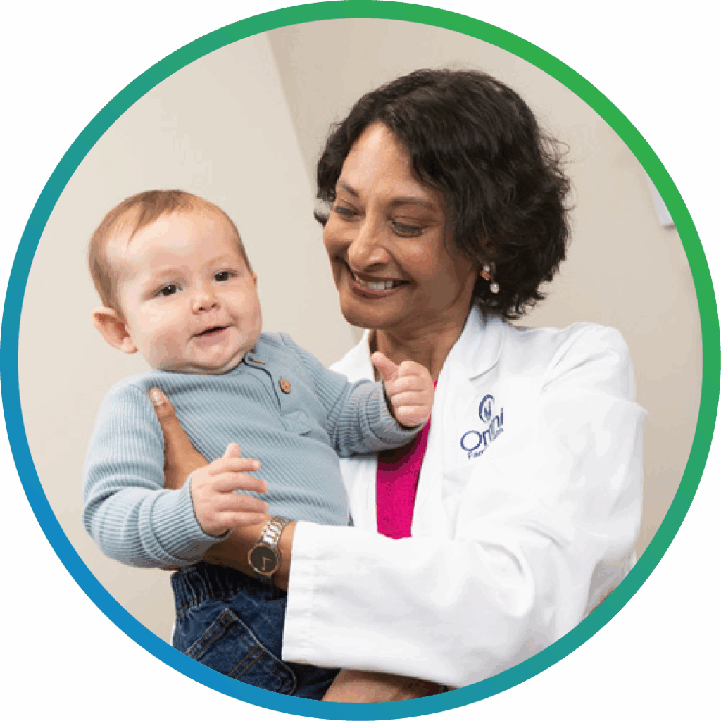 Pediatric provider holding infant patient