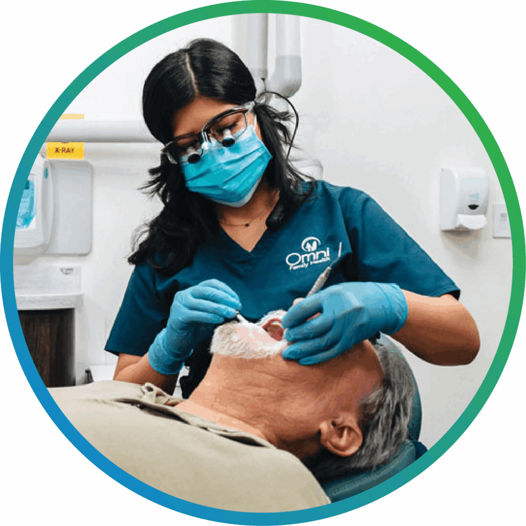 Dentist treating patient's teeth